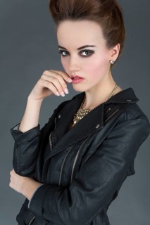 Young woman wearing a leather outfit