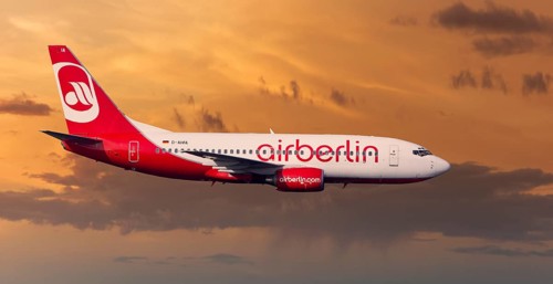 Air Berlin Boeing 737-73S in flight during a thunderstorm in the evening light