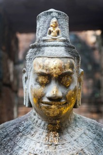 Buddhist statue of Bodhisattva Avalokiteshvara with offerings in the temple