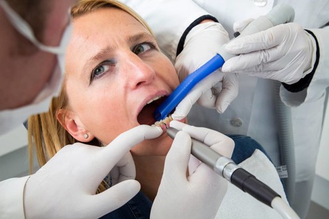Woman receiving treatment at the dentist
