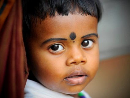 Child at a Hindu temple festival