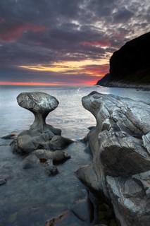 Kannestein or Kanne Stone with coastline at sunset