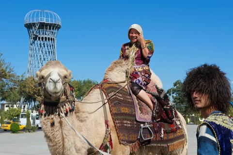 Local tourist on a camel outside the Ark fortress