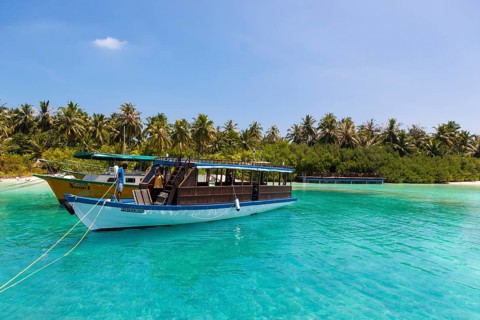 Boat in front of a Maldives island
