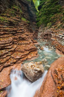 The Taugl river flowing through a red gorge