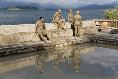 People taking a mud bath