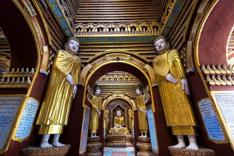 Seated and standing Buddha statues