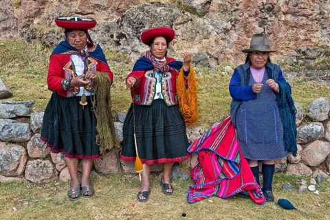Three elderly women wearing hats