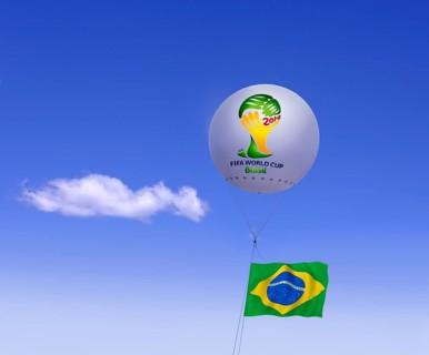 Logo of FIFA World Cup Brazil on moored balloon and Brazilian flag