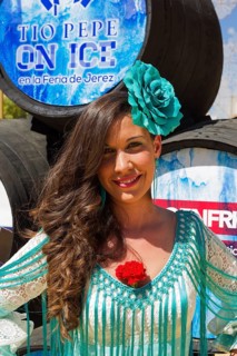 Young woman wearing a gypsy dress at the Feria del Caballo