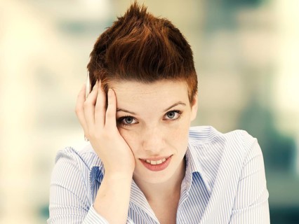 Young woman with her head propped up