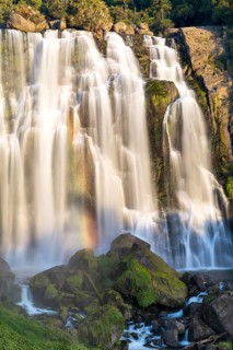 Marokopa Falls in the evening light with a rainbow