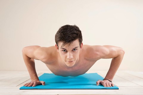 Young man doing pushups
