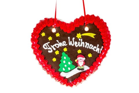 Gingerbread heart with the writing 'Frohe Weihnachten'
