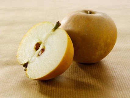 One whole and one cut Russet apple