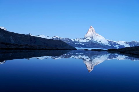 Mt Matterhorn reflected in Stellisee Lake at dusk