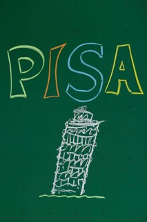 PISA' written with chalk on a blackboard