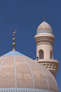 Mosque with a golden crescent moon and a minaret