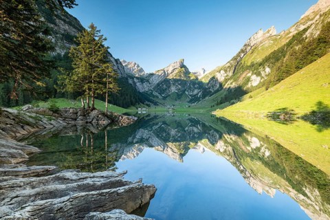 Mountains reflected at sunrise in Lake Seealpsee