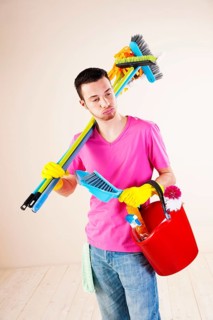 Man holding cleaning products in his hands