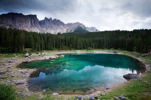 Lake Carezza with Latemar Mountain with clouds