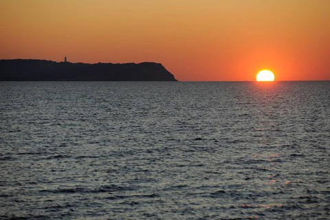 Sunset over the Baltic Sea beside Hiddensee Island with Dornbusch lighthouse
