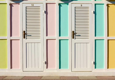 Pastel coloured beach cabins