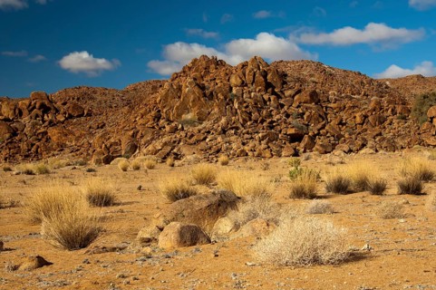 Desert landscape with the heavily eroded Granitberg Mountain in Richtersveld Transfrontier National Park