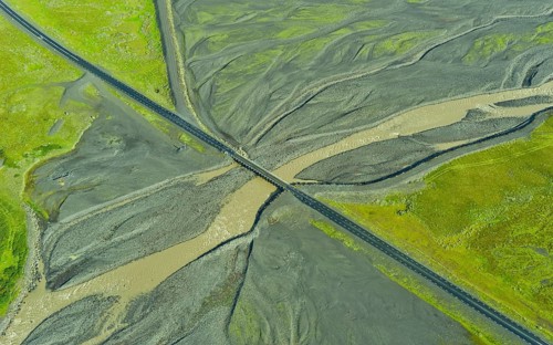 Aerial view of Ring Road No. 1 with a bridge crossing a tributary of the Skaftafellsa glacial river