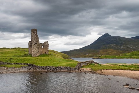 Ruins of Ardvreck Castle on a peninsula in the lake of Loch Assynt