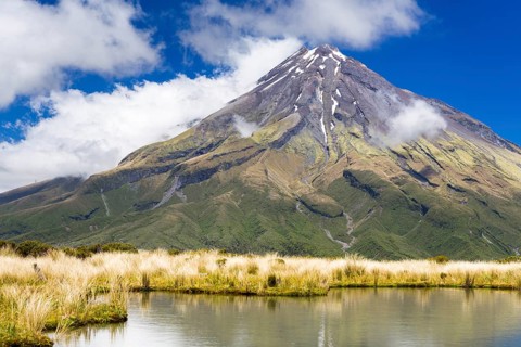 Mountain lake with the Mount Taranaki volcano