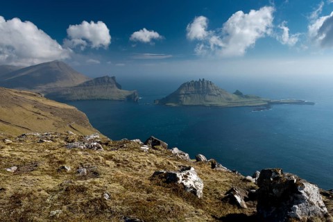 Rugged rocks of Tindholmur seen from the hiking trail between Bour and Gasadalur