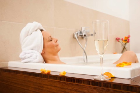 Woman relaxing in a bath