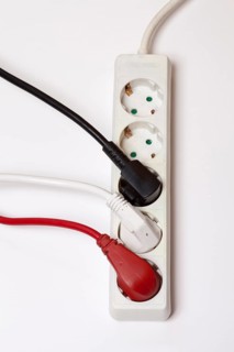Power strip with three different coloured plugs