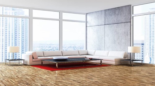 Living room with a corner lounge seating area in front of the windows