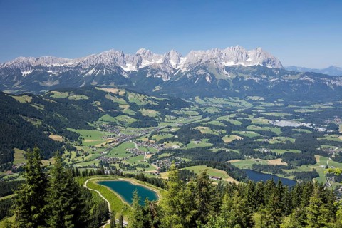 View from the Hahnenkamm summit onto impounding reservoir and Lake Schwarzsee