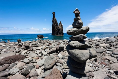Cairns built as good luck charms at the Ilheus da Rib rock formation