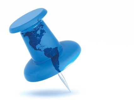 Push pin with a map of North America and South America