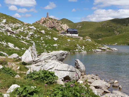 Wolayer Lake or Wolayersee with the Wolayersee hut and war memorial