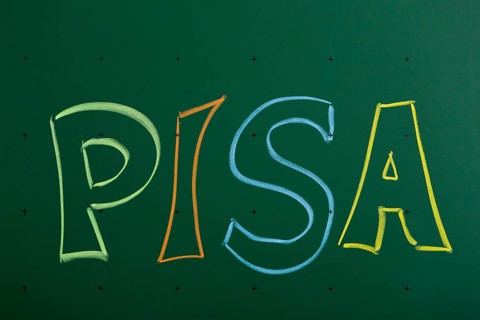 PISA' written with chalk on a blackboard