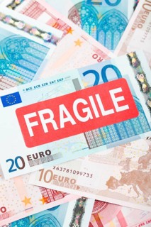 Euro banknotes with a 'Fragile' sticker