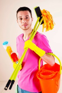 Man holding cleaning products in his hands