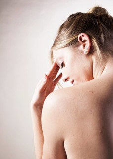 Young woman with a headache