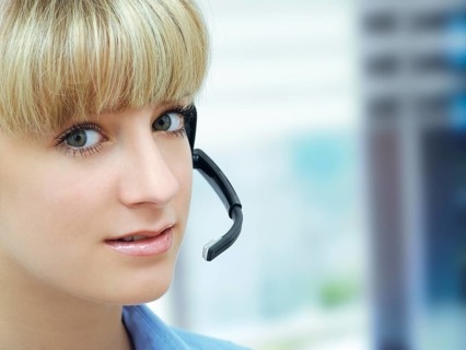 Businesswoman wearing a headset in an office