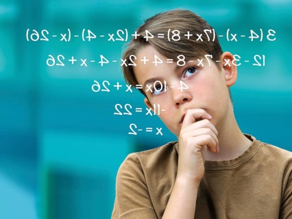Schoolboy pensively in front of a math problem
