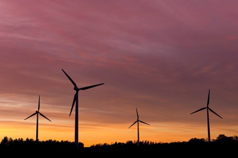 Wind turbines at sunset