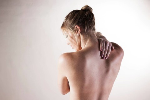Bare back of a young woman