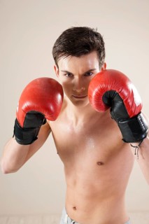 Young man during boxing training