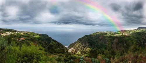 Rainbow above the cliffs at Arco de Sao Jorge