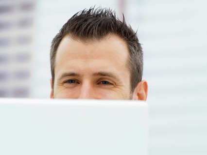 Businessman in an office with a laptop